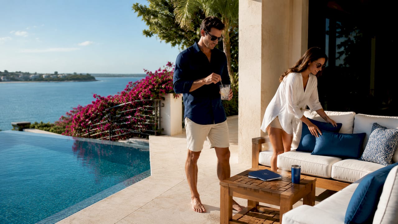 Outdoor terrace with infinity pool and tropical views