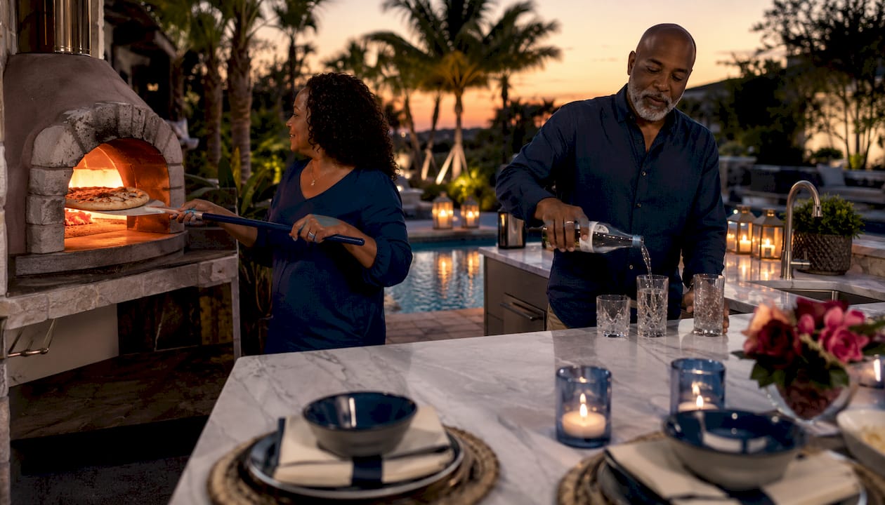 Couple hosting at Florida outdoor kitchen bar