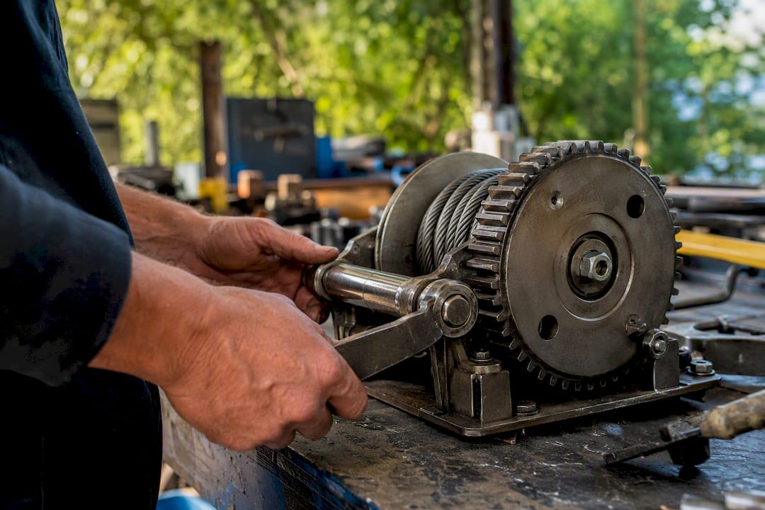 Hands testing marine winch parts
