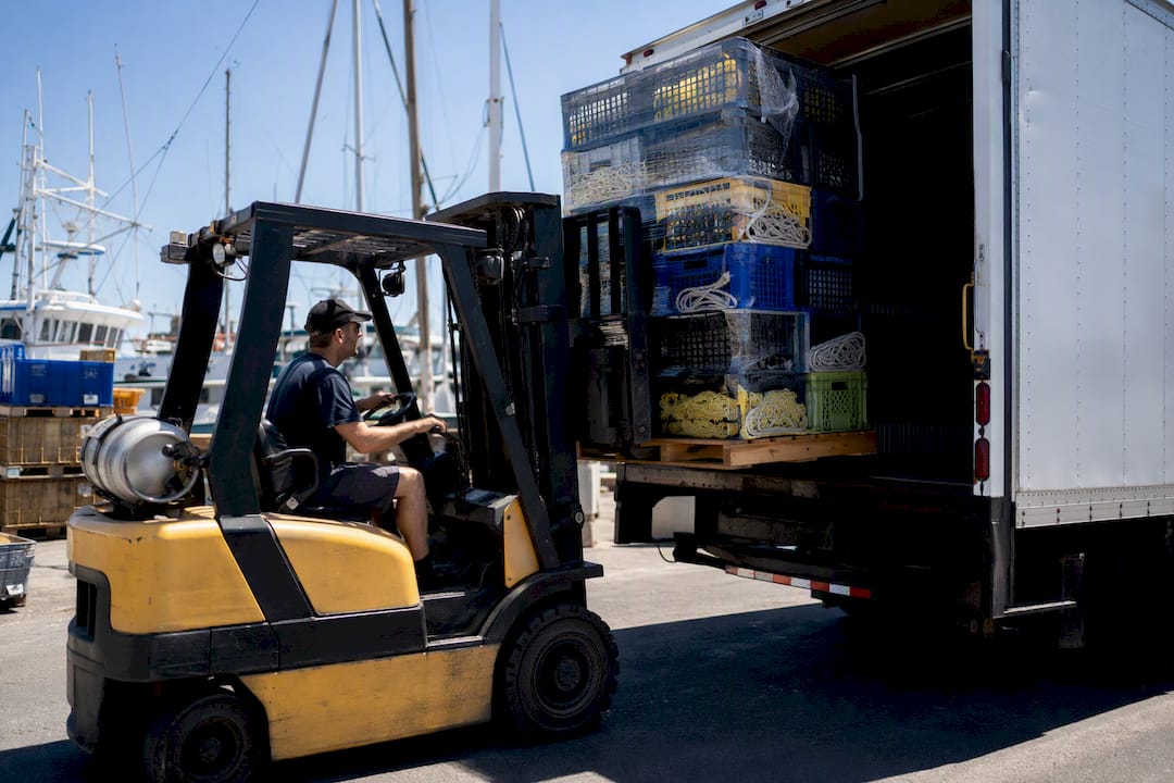 Forklift loading marine gear pallets