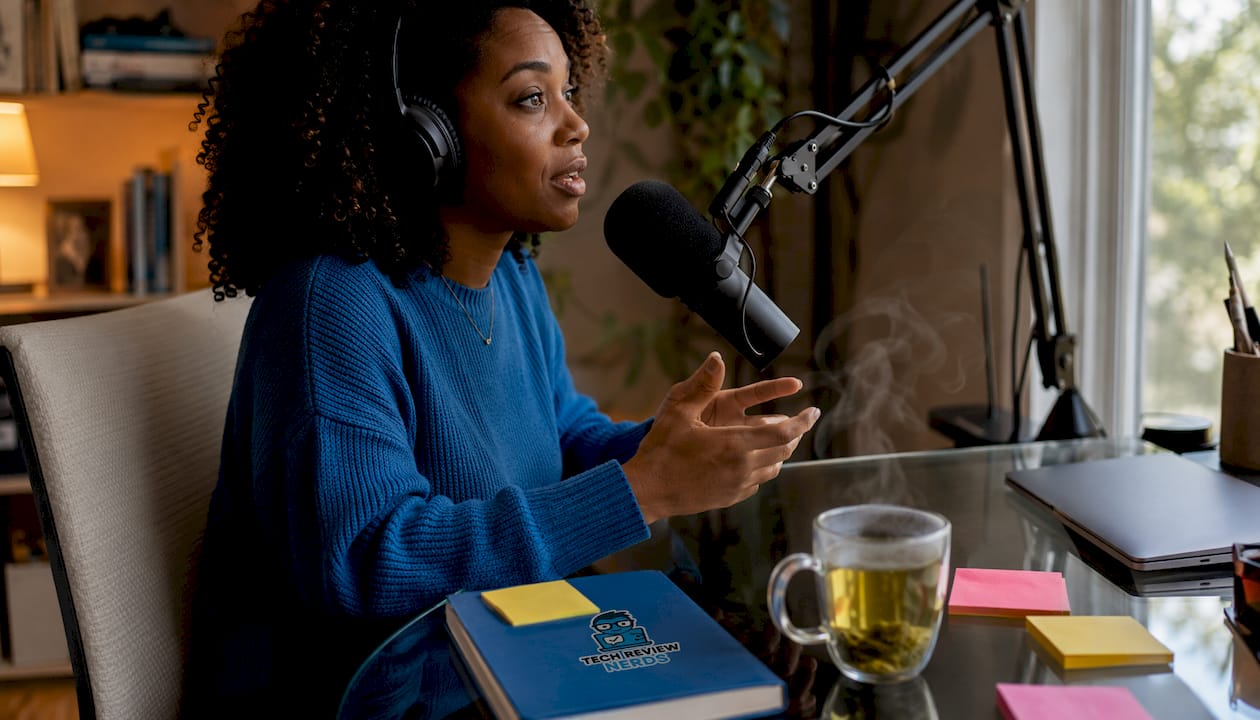 Home podcast recording with woman using Shure SM7B