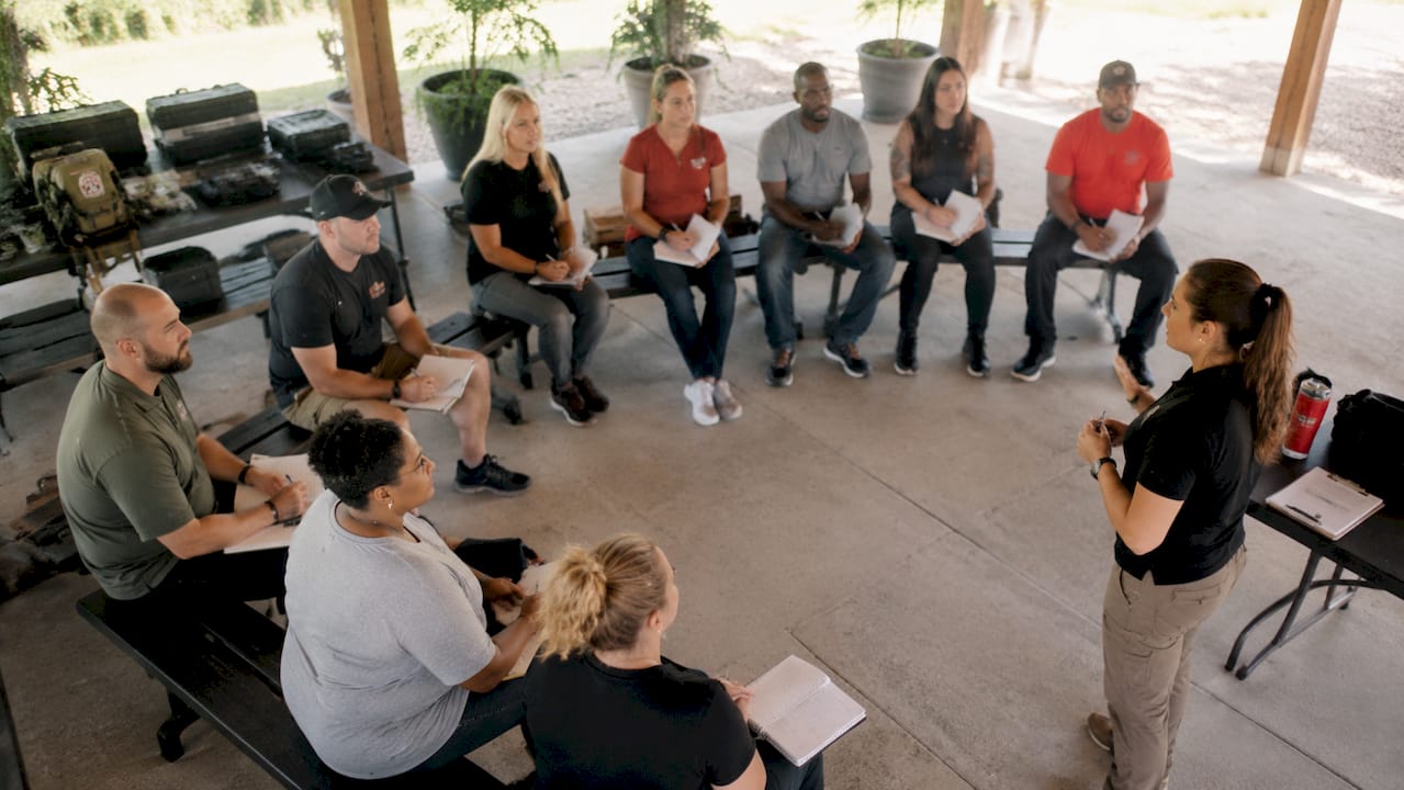 Group learning firearms safety in community center