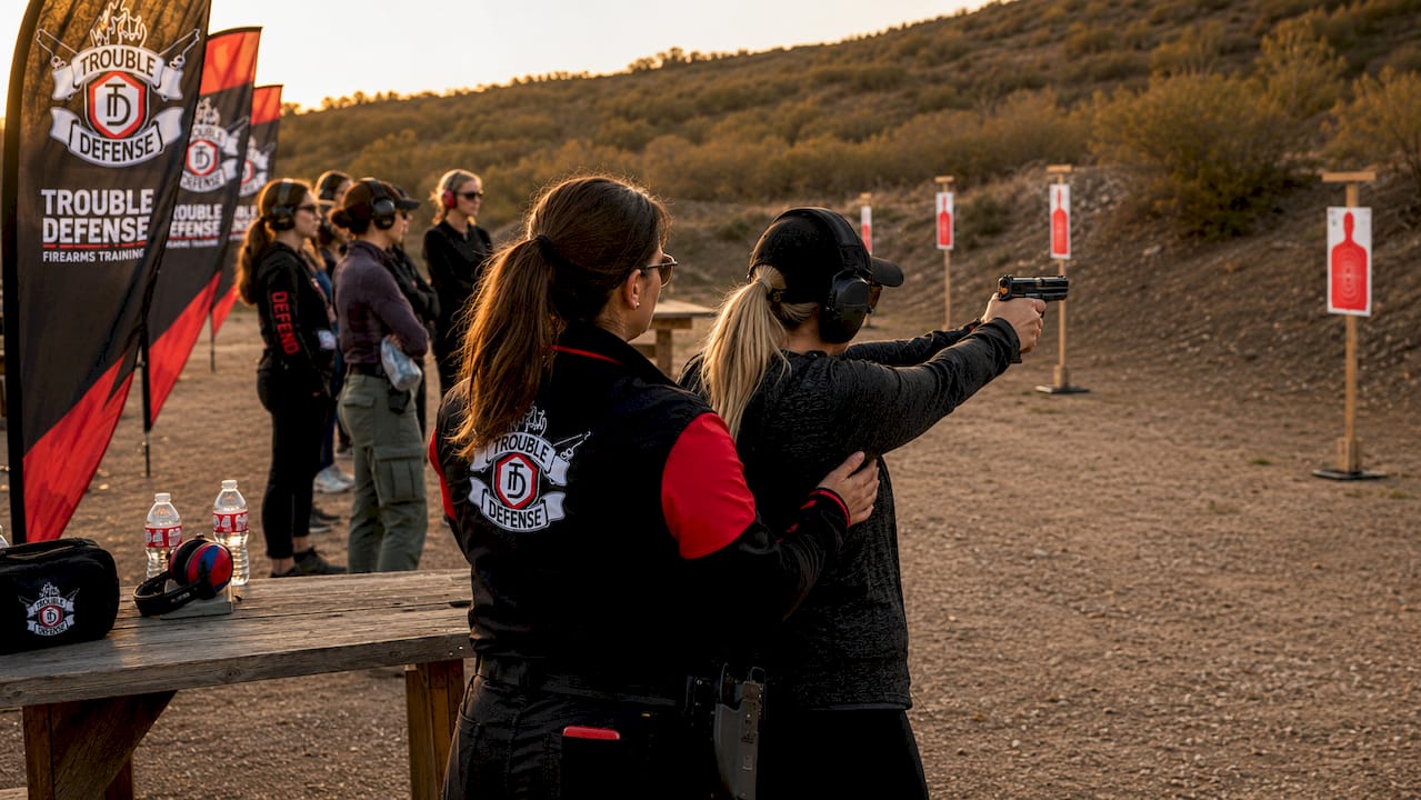 Women firearm training session with instructor