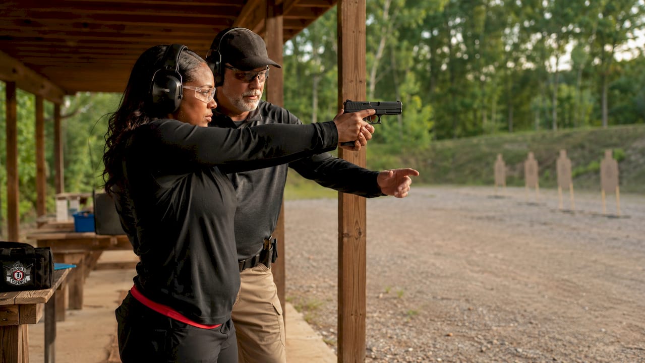 Woman focused shooting at indoor range