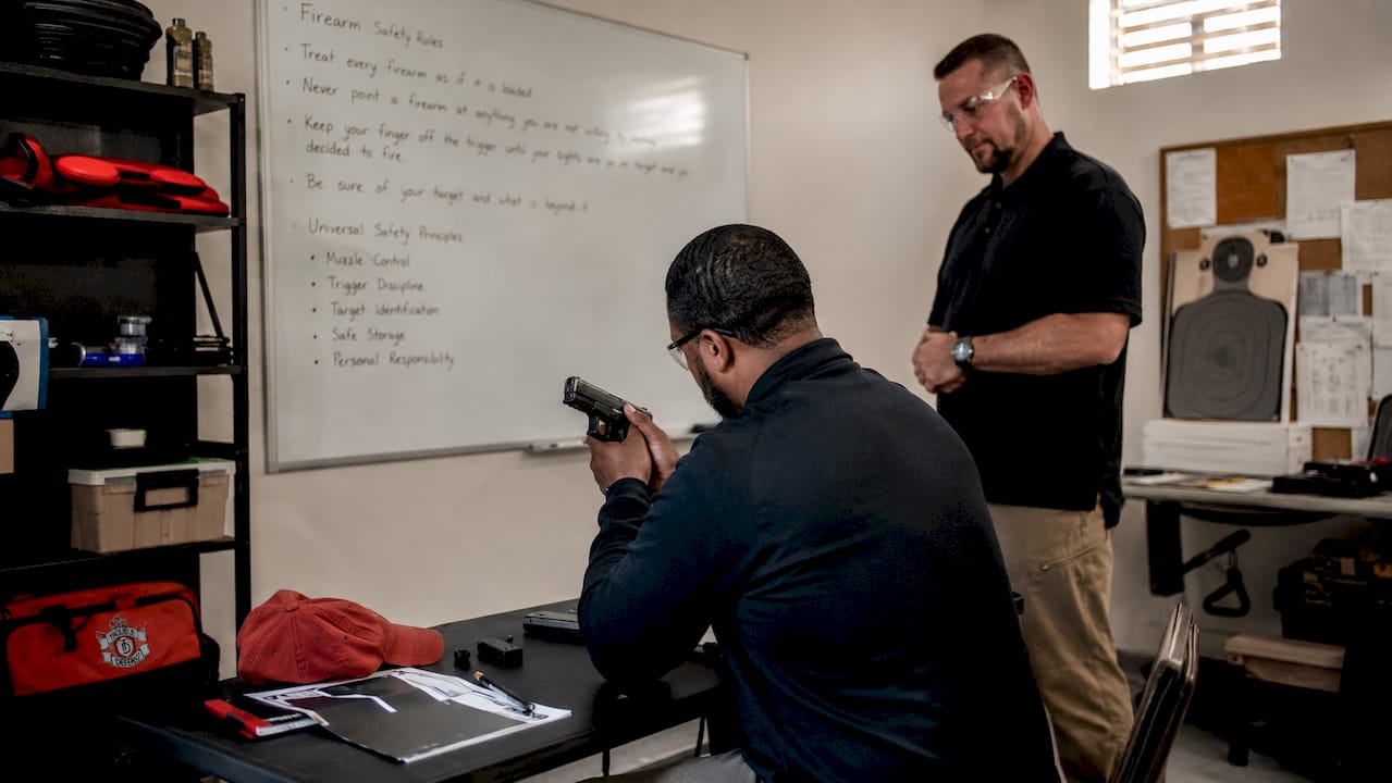 Man in firearm training session indoors