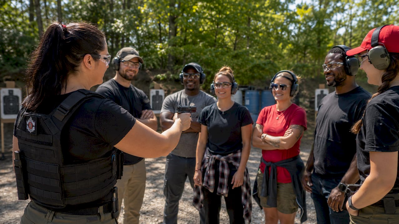 Firearms instructor teaching safety to trainees