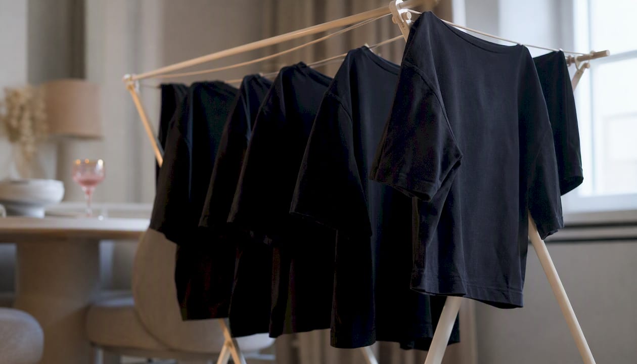 Black shirts air-drying indoors away from sunlight