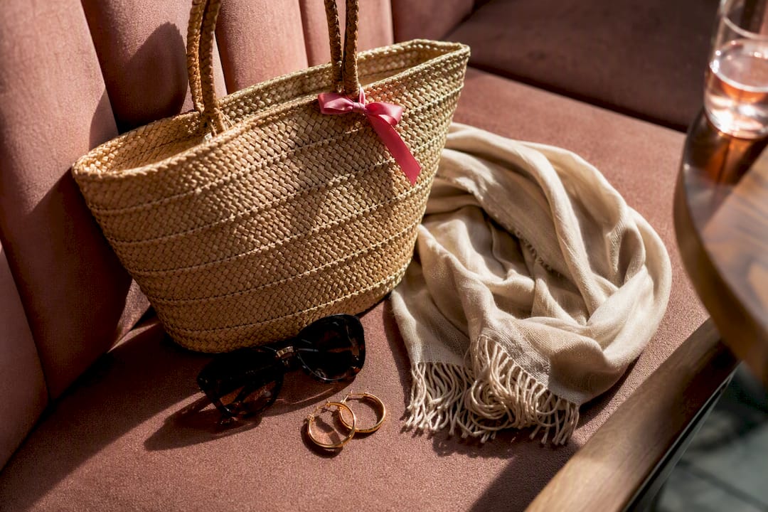 Sunglasses tote and gold hoops for party styling