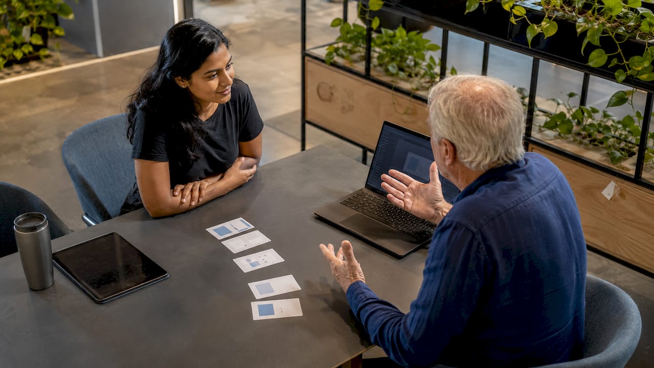 Moderator and participant engaged in a UX test