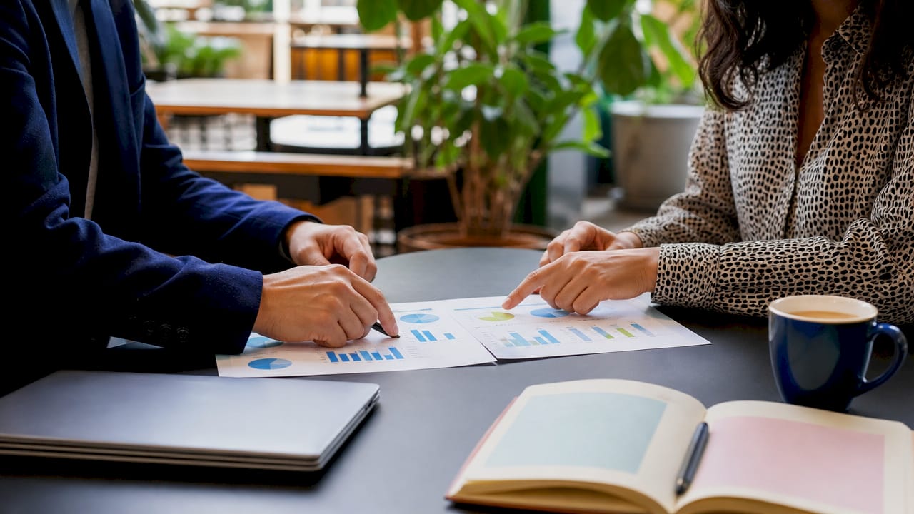 Hands pointing at A/B testing charts
