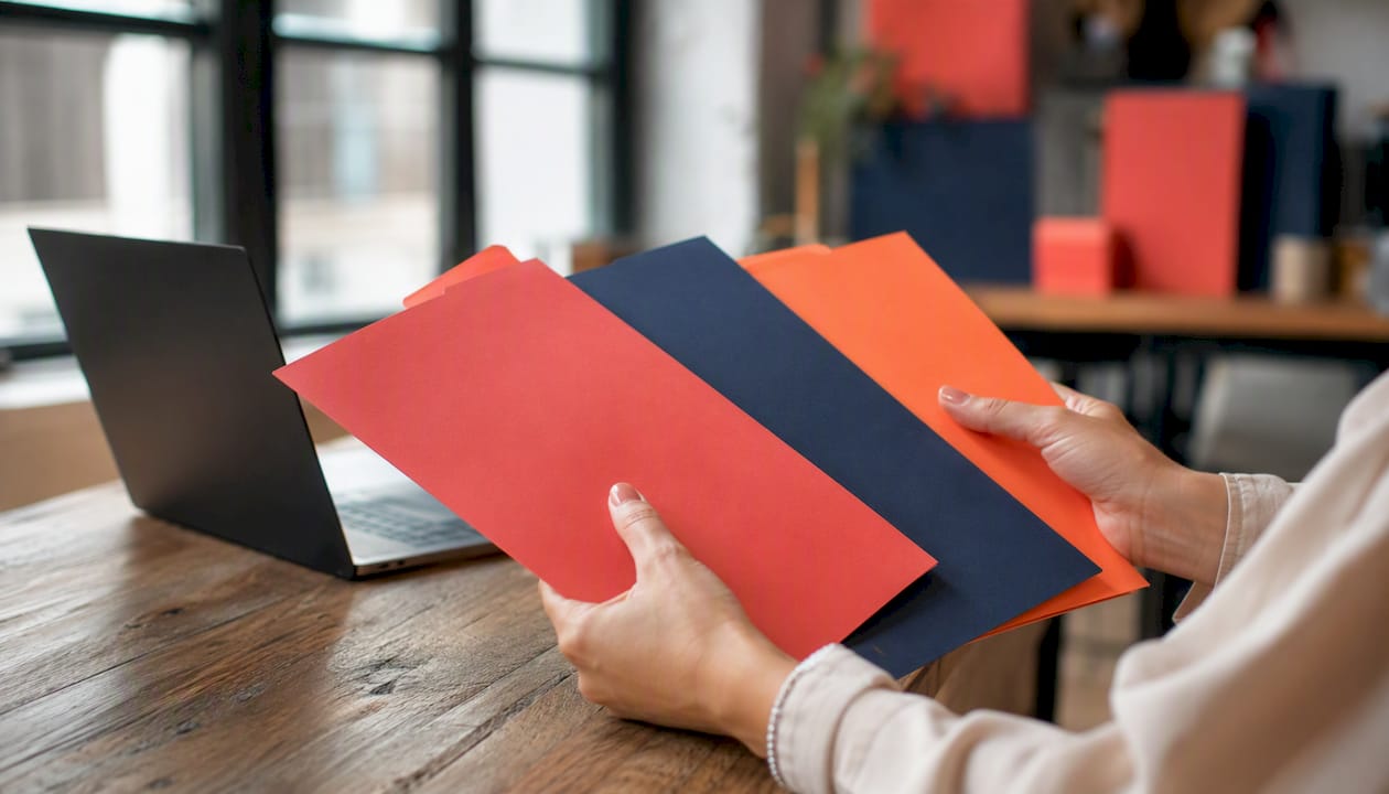 Startup messaging framework examples: build yours today 2 • MB Brand Communications Hands sorting color-coded messaging folders