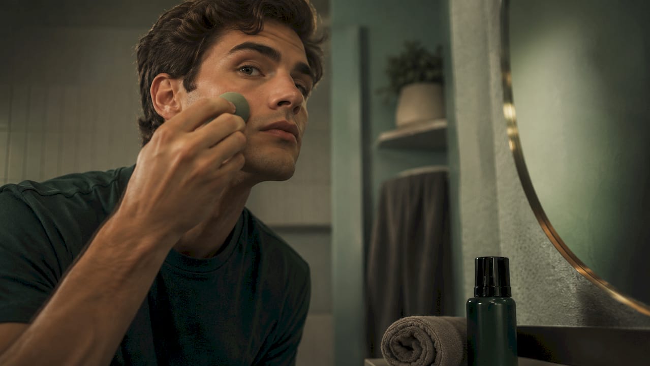 Close-up of concealer application on male skin