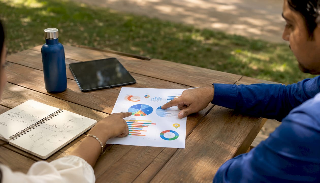 Two people analyzing business data together