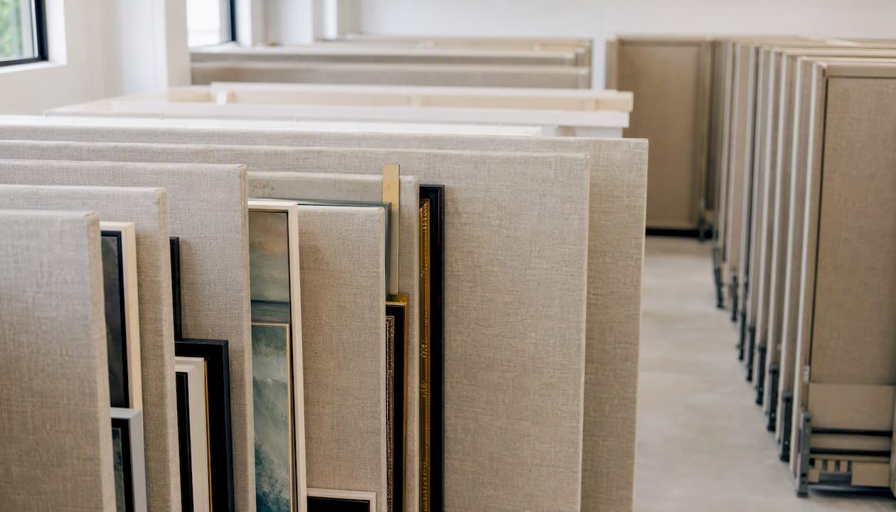 Padded picture racks holding framed canvases