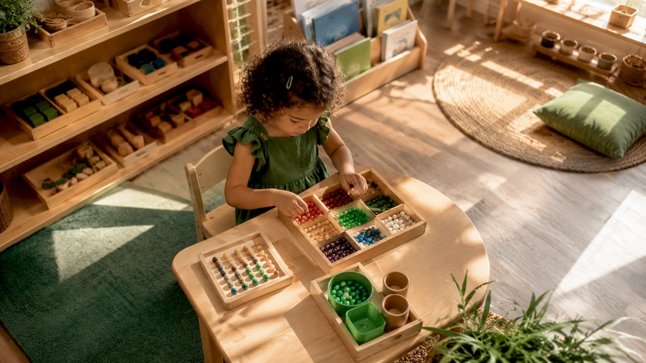 Young girl doing Montessori bead sorting activity