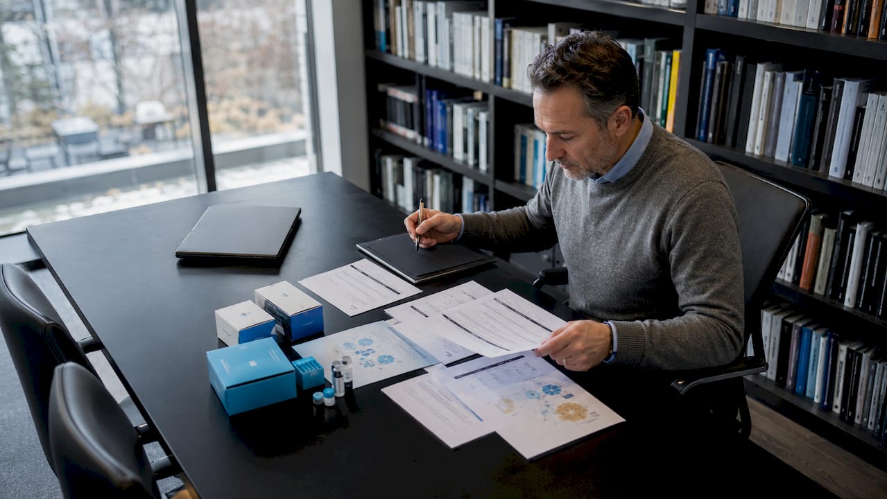 Researcher evaluating peptide testing criteria at desk
