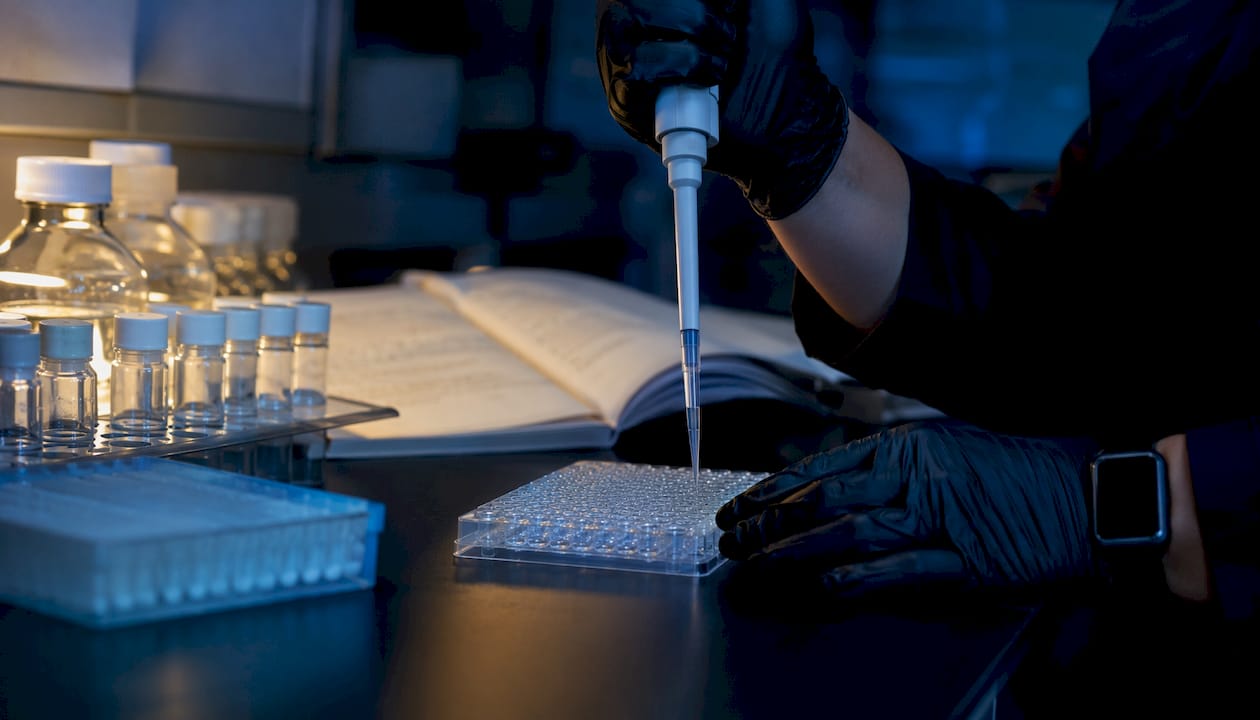 Technician preparing peptide stability assay samples