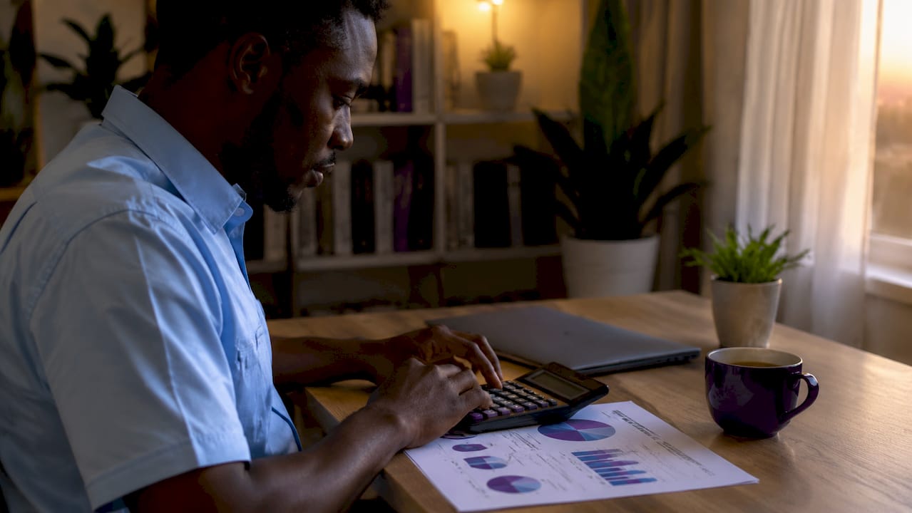 Close-up of hands calculating quarterly taxes