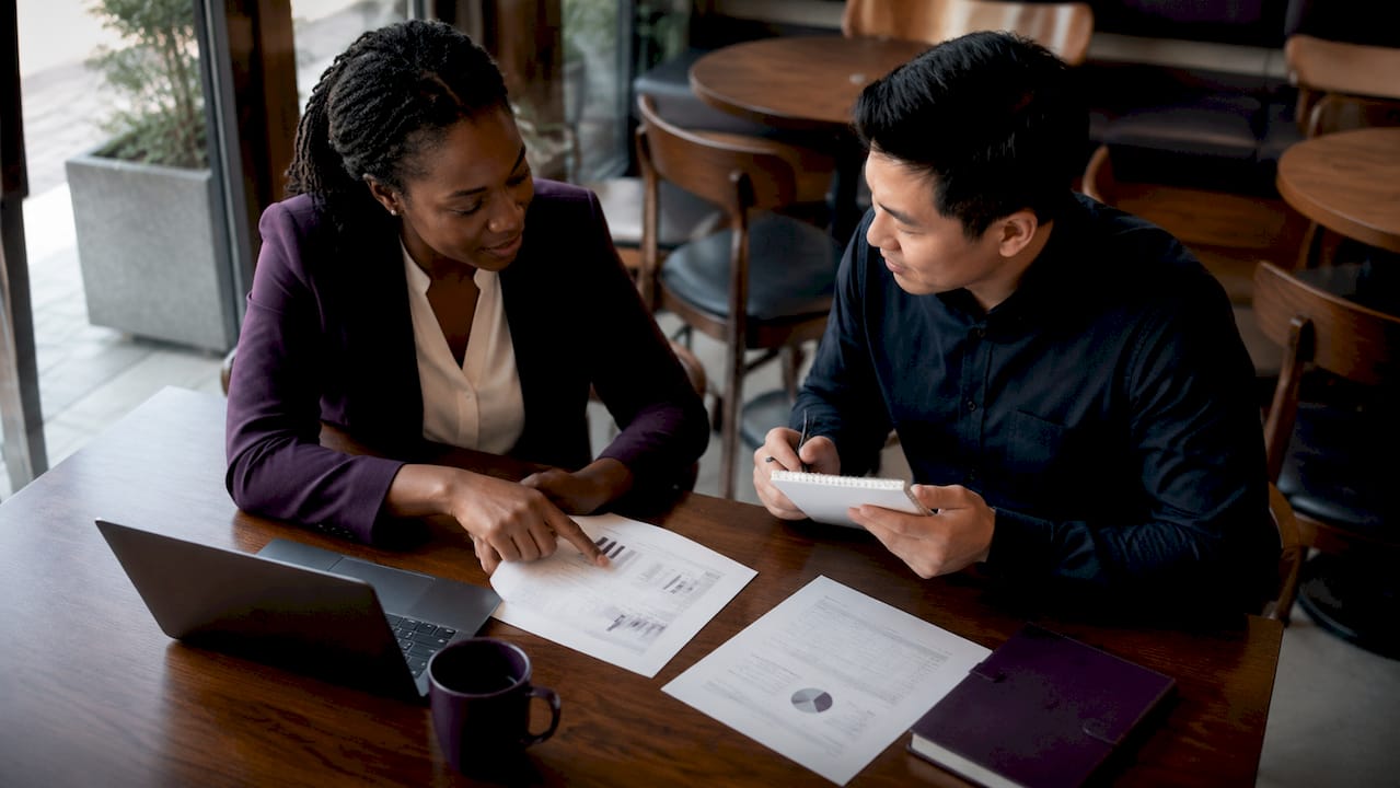 Accountants discussing tax planning documents