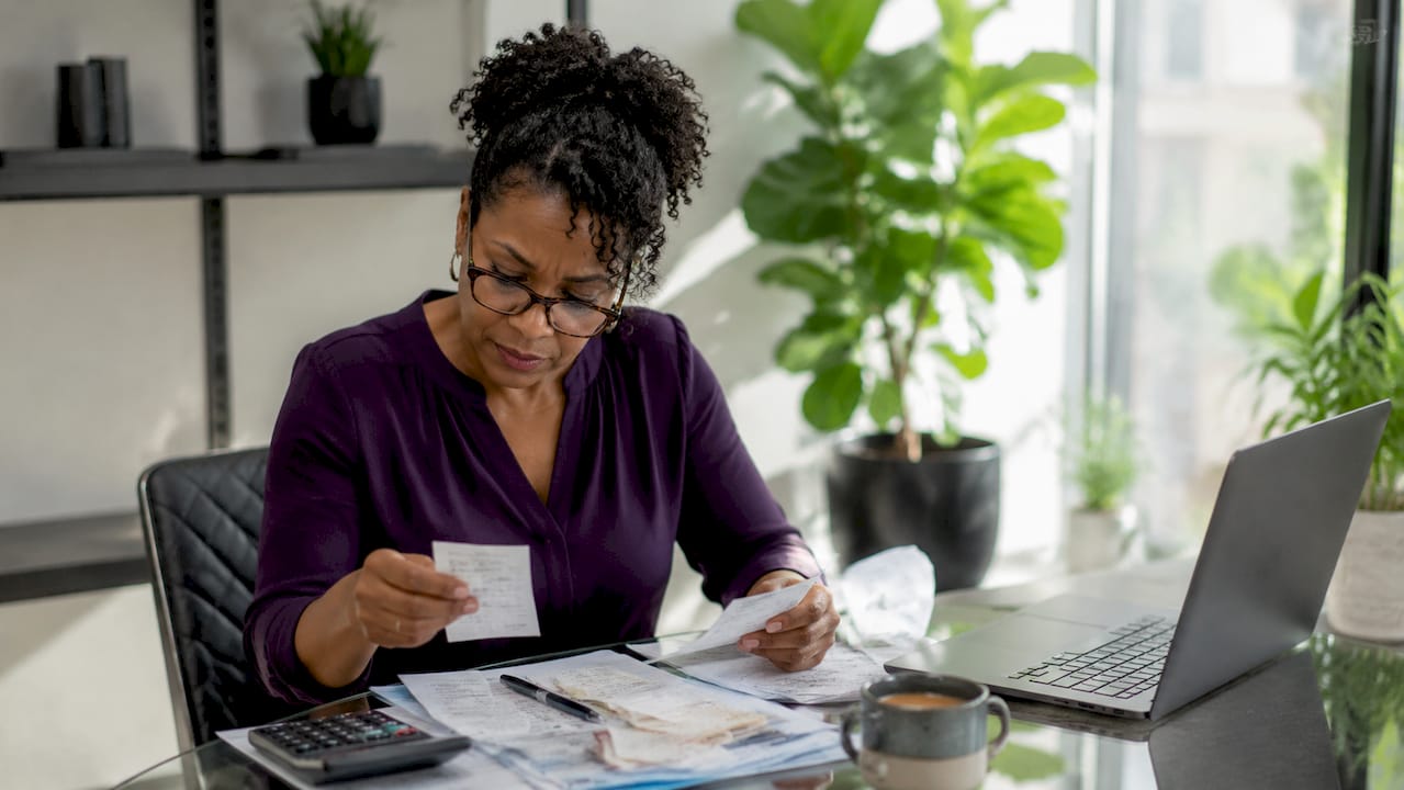 Small business owner reviewing tax documents