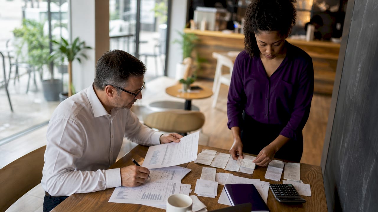 Accountant and bookkeeper working side by side
