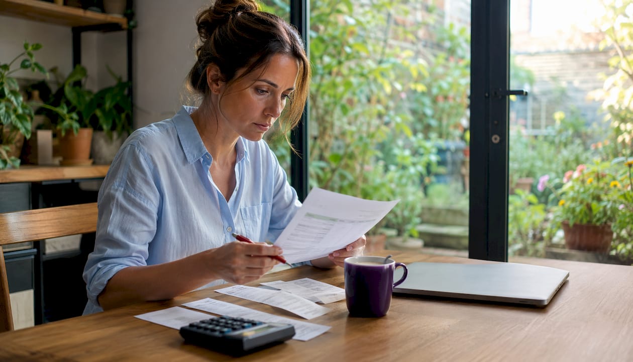 Small business owner reviewing bookkeeping documents