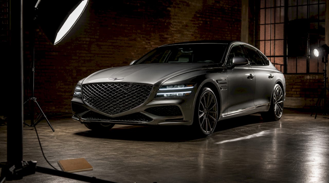 Three-point lighting setup on luxury car side