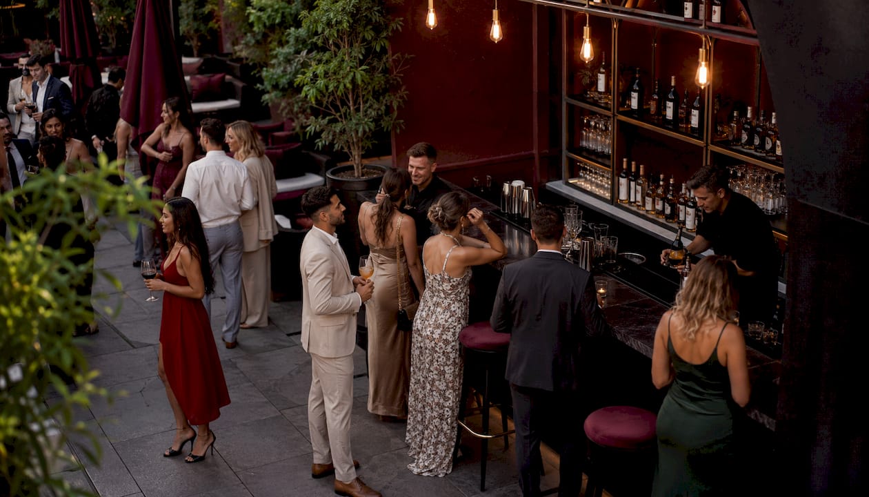 Wedding guests ordering drinks at cash bar