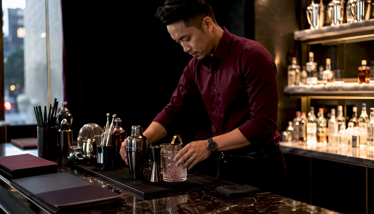 Bartender preparing tools on bar counter