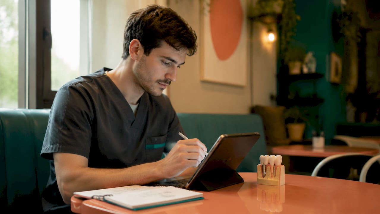 Dentist working on digital implant case files