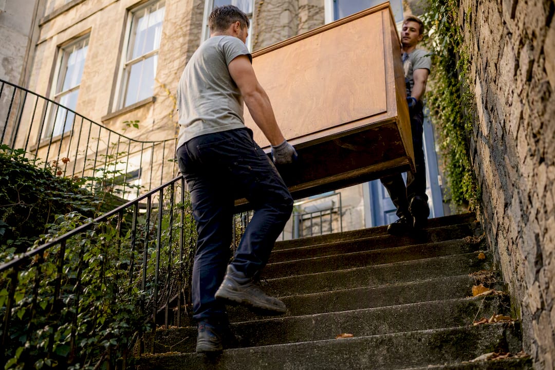 Furniture being carried up stairs