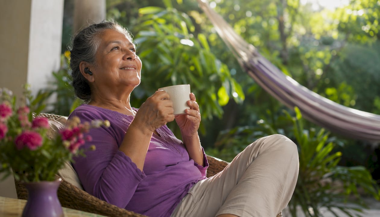 Senior woman relaxing with music
