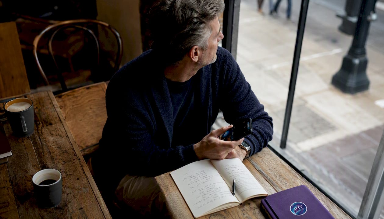 Man reflecting while choosing playlist