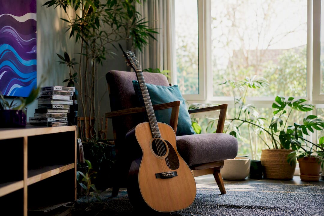 Acoustic guitar and soft ambient lighting in cozy corner