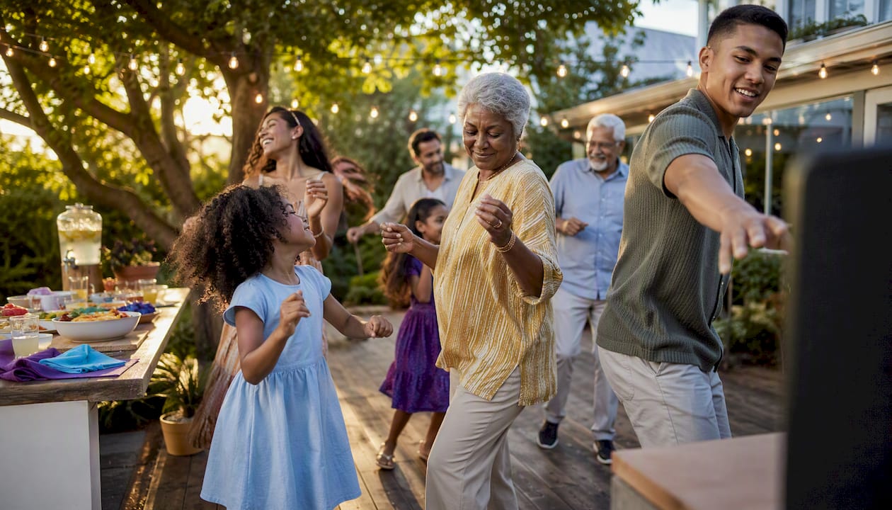 Relatives dancing together at family reunion