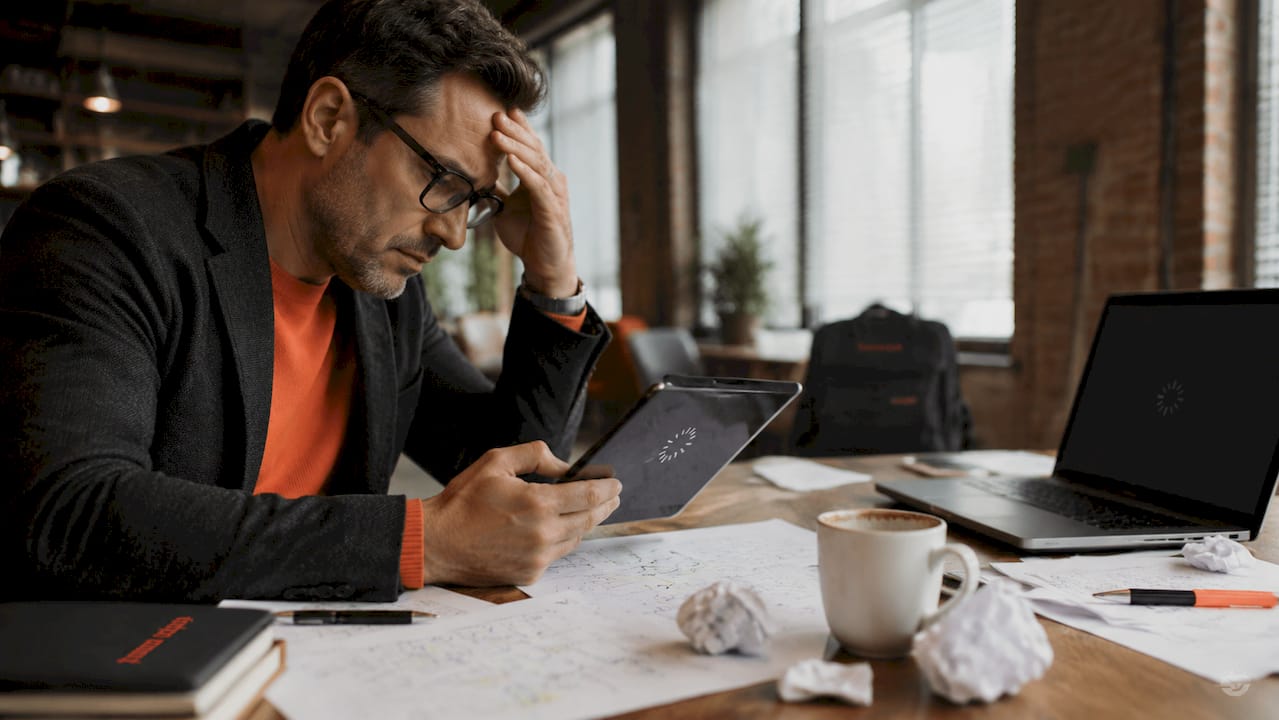 Coach frustrated by slow website loading on laptop Coach frustrated by slow website loading on laptop
