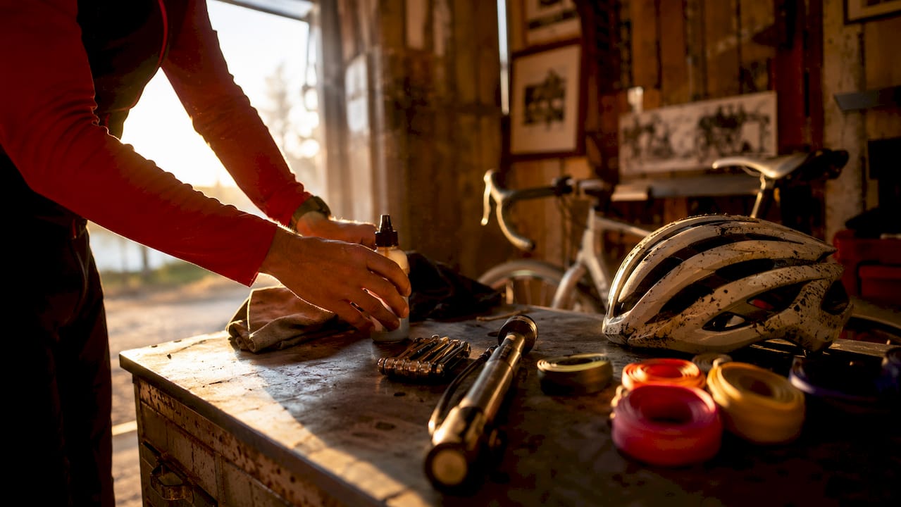 Hands assembling cyclocross race gear checklist