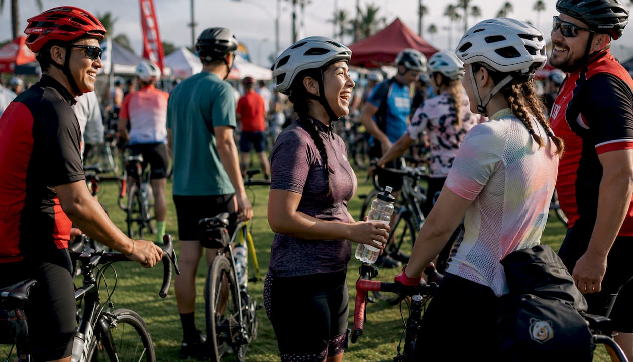 Diverse cyclists gathered at community cycling event start