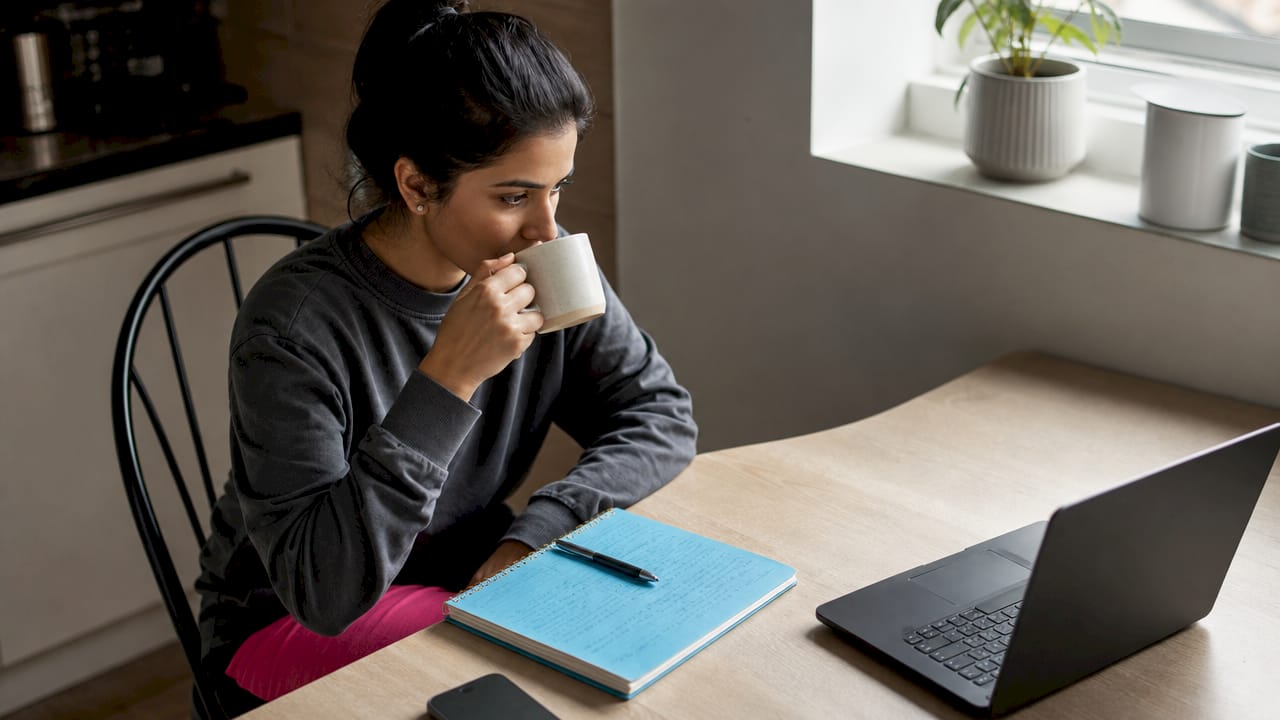 Web developer checking website performance data at home desk