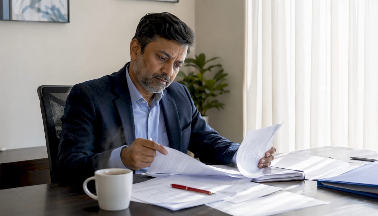 Forensic psychiatrist reviewing mental status exam records