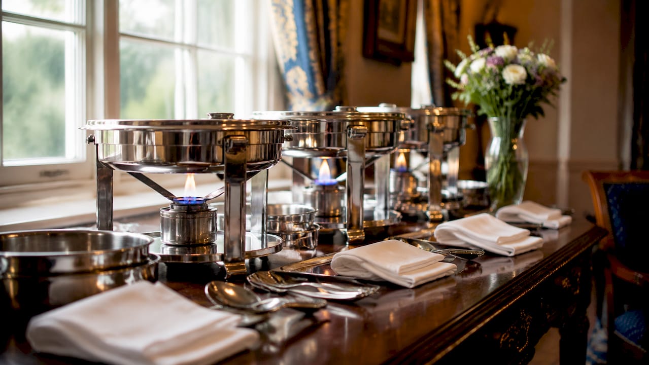 Close-up of buffet service equipment and utensils