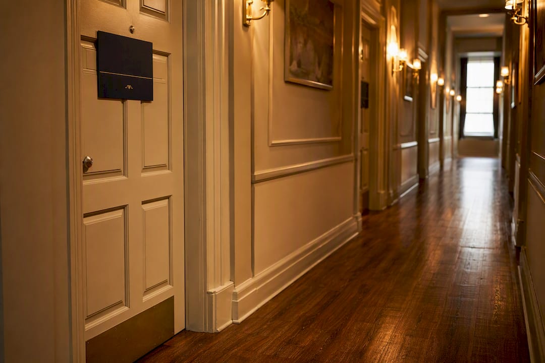 Empty hotel corridor with room block signs