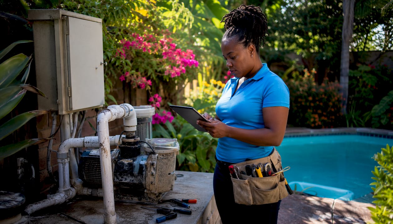 Specialist inspecting pool system for automation retrofit