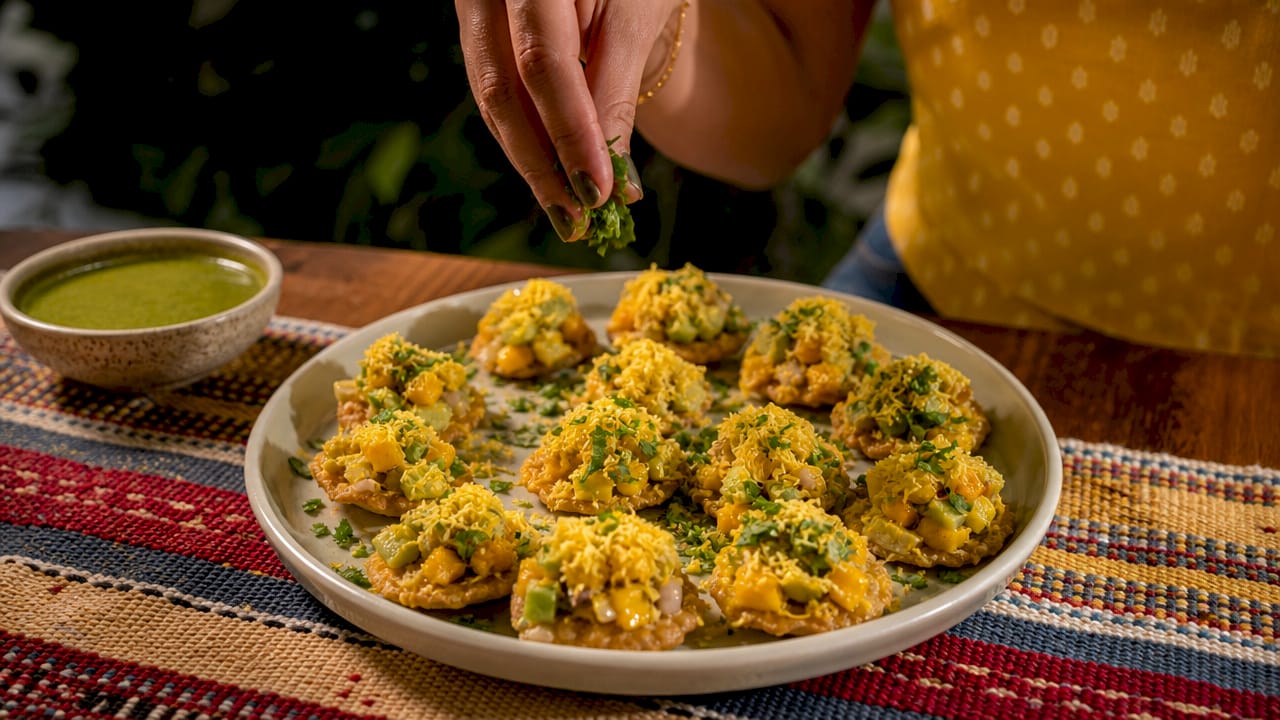 Close-up of sev puri with mango avocado salsa
