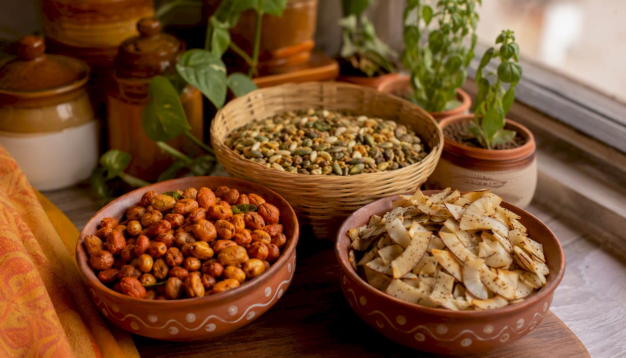 Whole-ingredient Indian snacks on wooden table