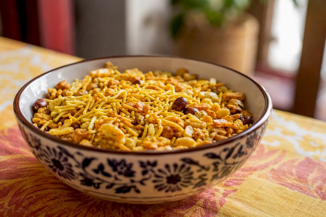 Close-up of Indian namkeen snacks on wooden platter