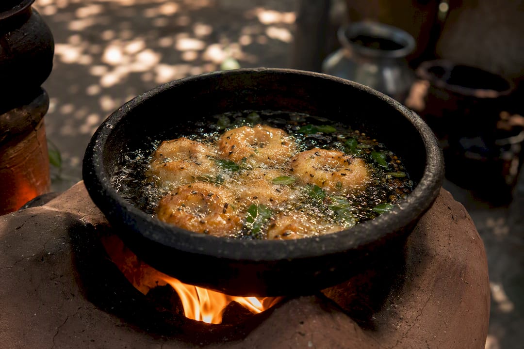 South Indian lentil fritters frying with curry leaves
