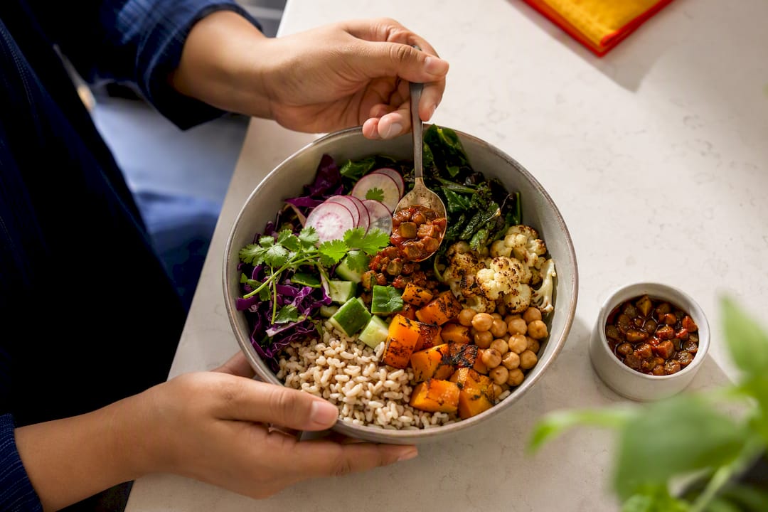 Mango pickle folded into grain bowl