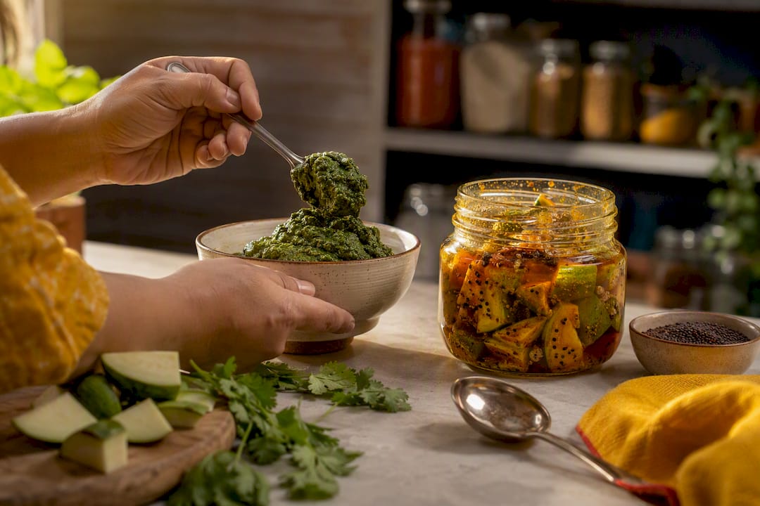 Fresh chutney and achar prepared side by side