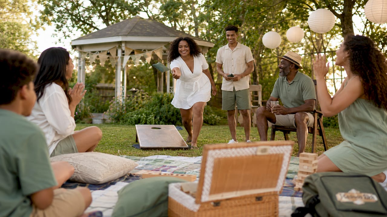 Family playing games outdoors at retreat venue